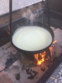 High angle view of fire in barbecue grill