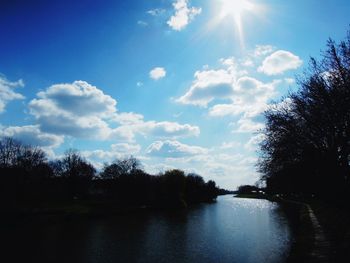 Scenic view of lake against cloudy sky