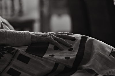 Cropped hand of man holding suitcase