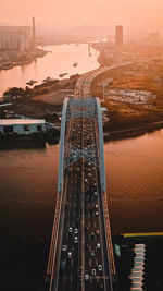 High angle view of bridge over river at sunset