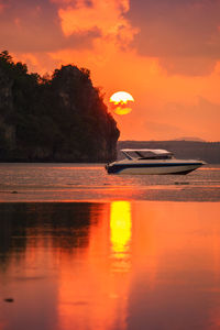 Scenic view of sea against orange sky