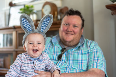 Portrait of happy boy with baby