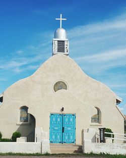 Low angle view of church against blue sky