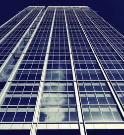 Low angle view of office building against sky