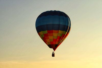 Low angle view of colorful hot air balloon against sky during sunset