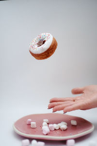 Close-up of hand holding ice cream