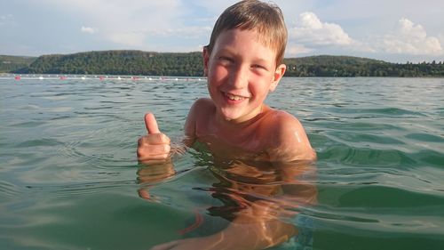 Portrait of smiling boy in water