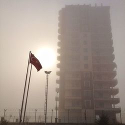 Low angle view of built structure at sunset