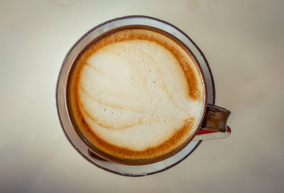 Directly above shot of cappuccino on table