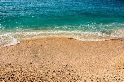 High angle view of sea waves rushing towards shore