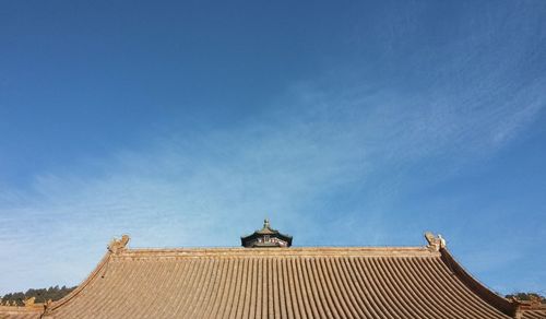 Low angle view of building against blue sky