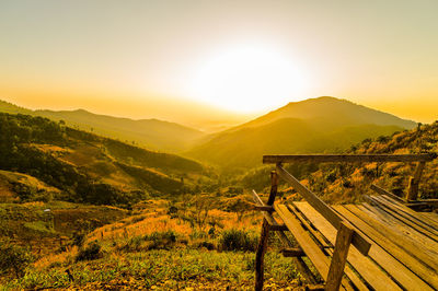 Scenic view of landscape against sky during sunset