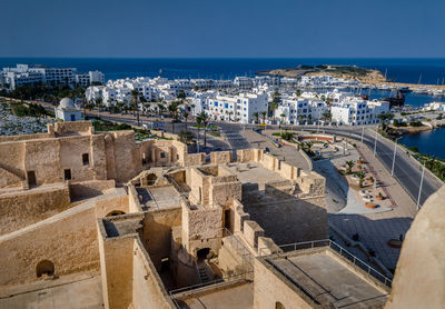 High angle view of townscape by sea