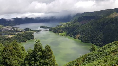 Panoramic view of trees and mountains against sky