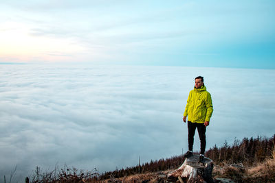 Full length of man standing on land against sky