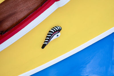 Close-up of yellow butterfly on wall