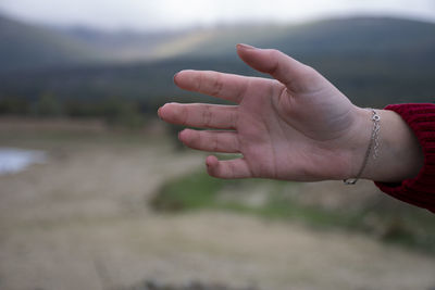 Close-up of woman hand on blurred background