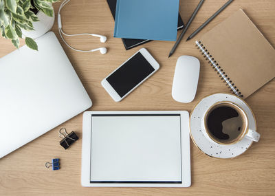 Office workplace with laptop on wooden table