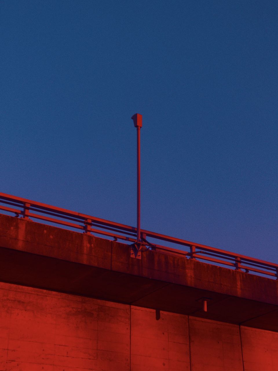 red, architecture, sky, built structure, transportation, clear sky, no people, bridge, evening, reflection, nature, line, blue, dusk, low angle view, light, building exterior, night, railing, outdoors, copy space, city