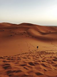 Scenic view of desert against clear sky