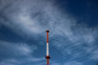 Low angle view of communications tower against sky