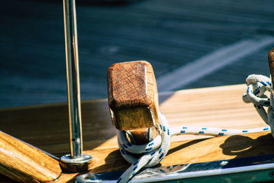 High angle view of rope on railing against sea