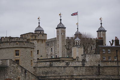 Low angle view of bell tower against sky