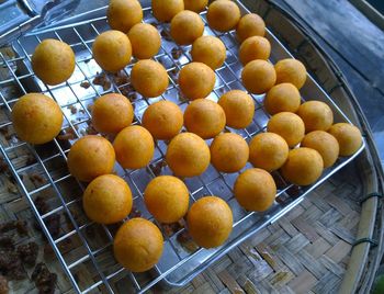 High angle view of oranges in container