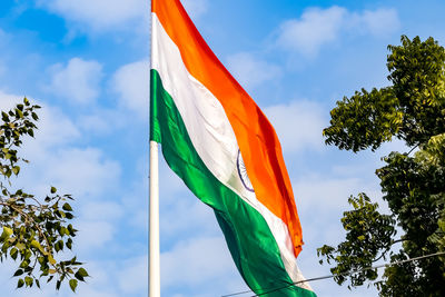 India flag flying high at connaught place with pride in blue sky, india flag fluttering, indian flag