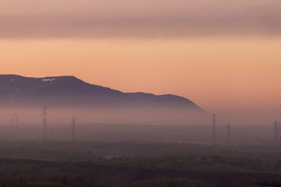 Scenic view of mountains against sky during sunset