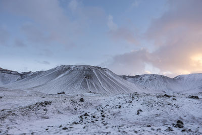 Scenic view of mountains against sky during winter