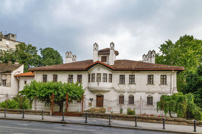 Building by street against sky