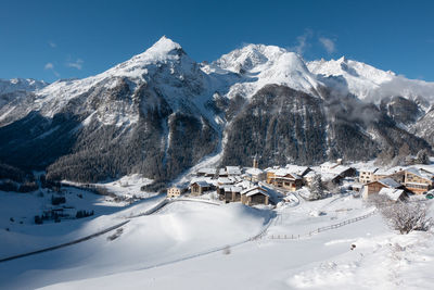 Scenic view of snowcapped mountains against sky