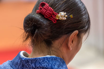 Close-up of woman against defocused background