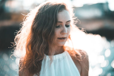 Close-up of young woman looking down