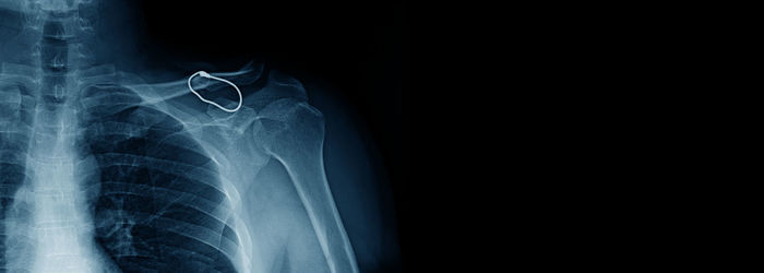 Close-up of human hand against black background