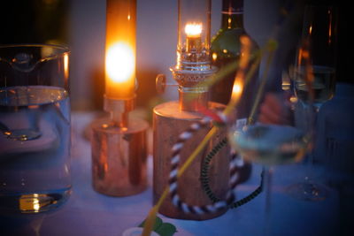 Close-up of illuminated lighting equipment on table