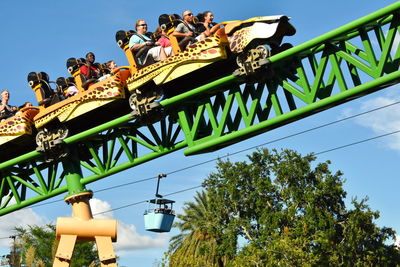 Low angle view of amusement park ride against sky