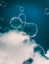 Close-up of bubbles against rainbow