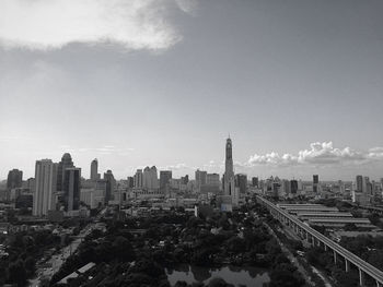 Cityscape against cloudy sky
