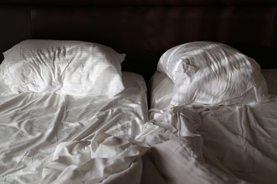 High angle view of messy bed