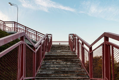 Low angle view of staircase against blue sky