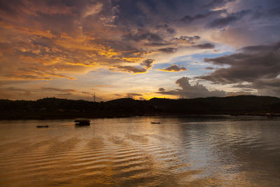 Scenic view of lake against sky during sunset