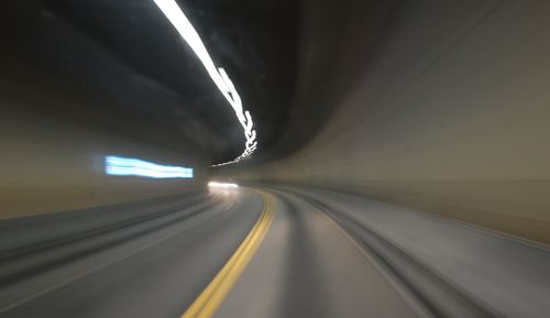 Light trails on road in tunnel