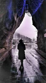 Reflection of woman in puddle