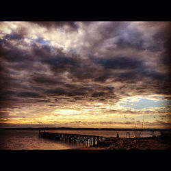 Scenic view of sea against dramatic sky