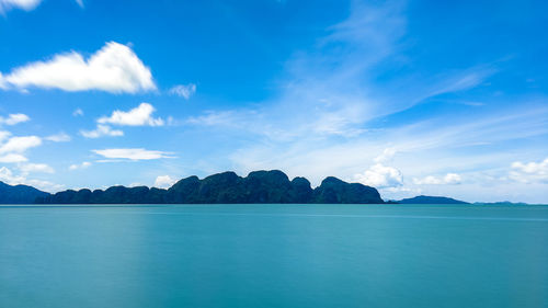 Panoramic view of sea against blue sky