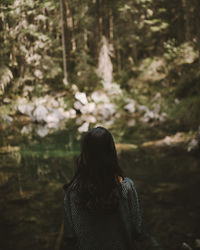 Rear view of woman in the woods