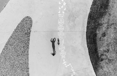 Drone photo of woman with text on tiled floor