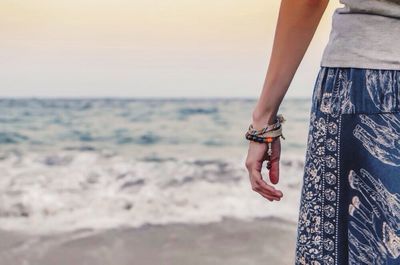 Woman standing on beach